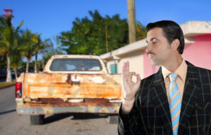 car used salesperson selling old car as brand new