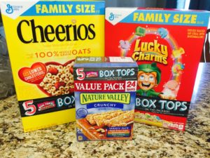If you're one who constantly forgets to cut off those .10 box tops before you throw them out, try this great idea! Start supporting your local school! #sponsored #ad