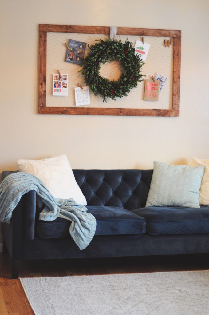 DIY- Create this holiday card holder for under $15. Using chicken wire and stained wood.