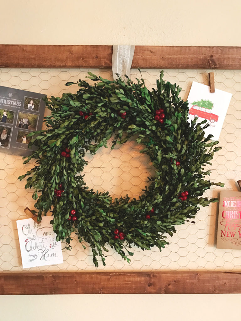 DIY- Create this holiday card holder for under $15. Using chicken wire and stained wood.