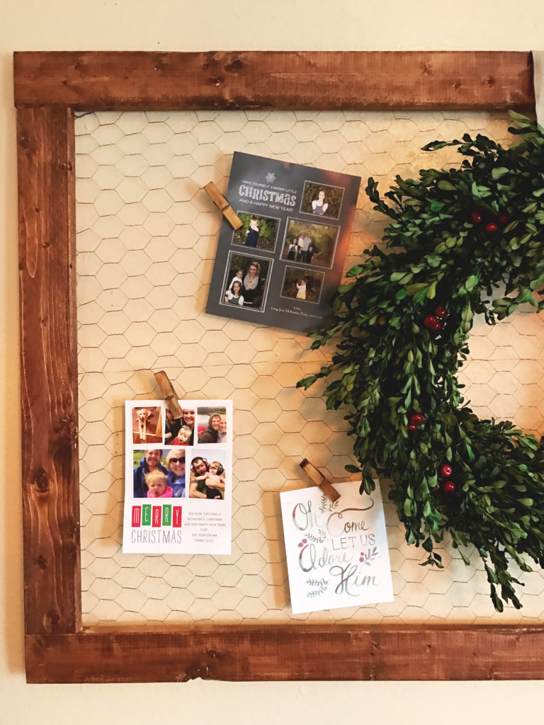 DIY- Create this holiday card holder for under $15. Using chicken wire and stained wood.