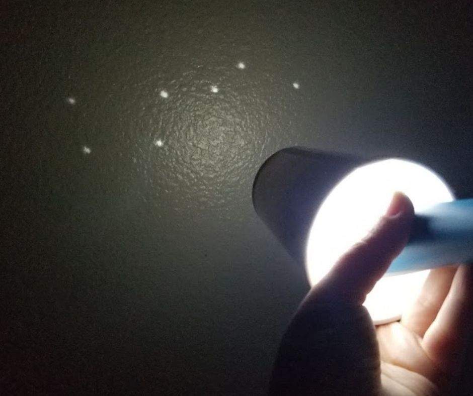the big dipper shining on a wall through a constellation viewer