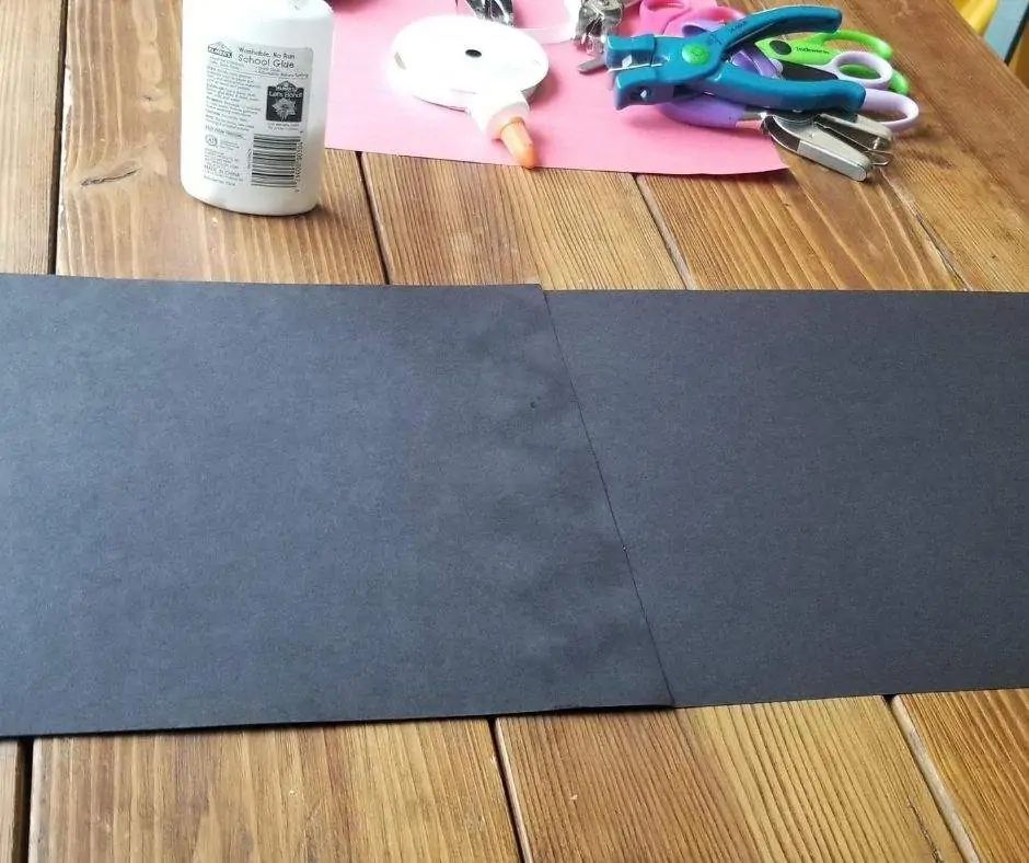 Black construction paper glued together length wise